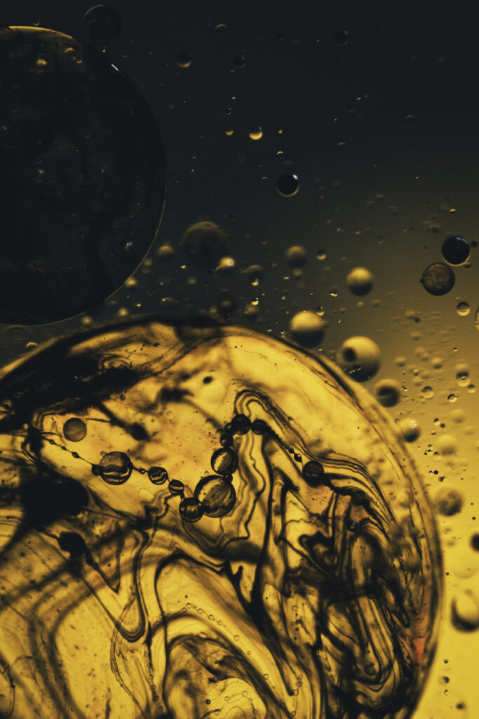 Abstract Yellow Liquid Wallpaper with Dark Patterns - Fluid Background