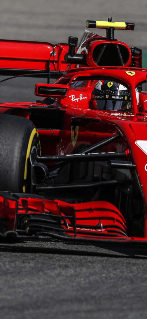 Ferrari's Fiery Fury: SF71H Roars Through F1 2018 Track Wallpaper