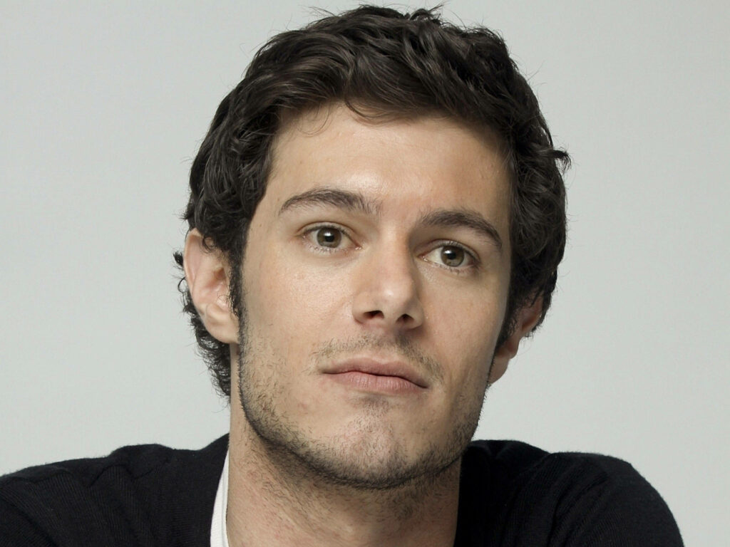 Adam Brody portrait wallpaper with relaxed expression and casual style on neutral background