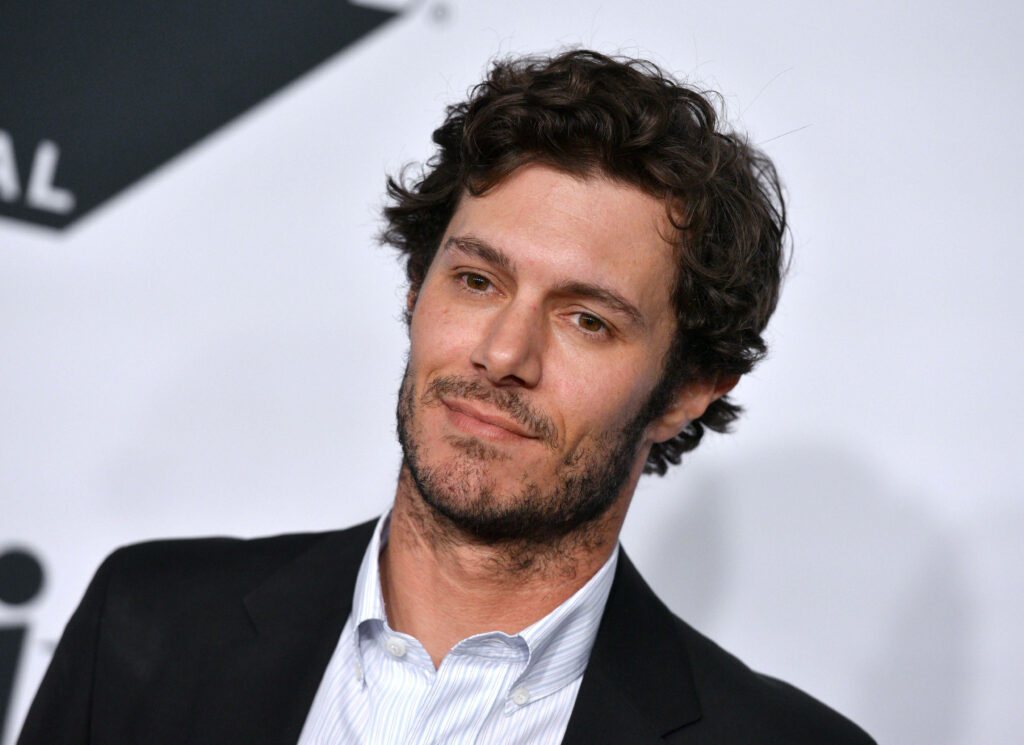 Adam Brody in classic suit with charming smile elegant confident wallpaper background