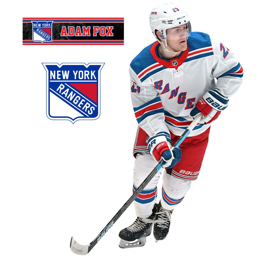 Adam Fox in white New York Rangers uniform poised on ice with Rangers logo and name above Wallpaper