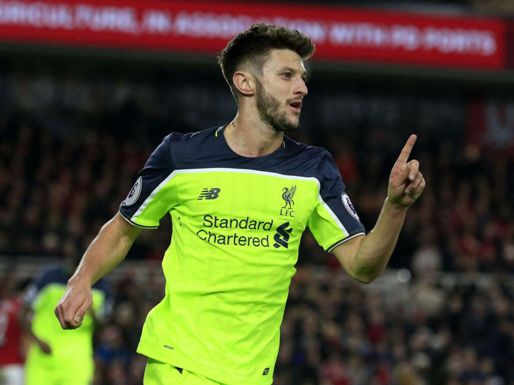 Adam Lallana celebrating goal for Liverpool pointing confidently in dynamic football wallpaper