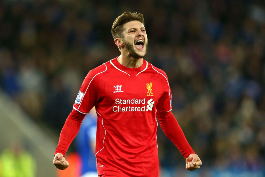 Adam Lallana celebrating passionately in Liverpool kit during intense football moment wallpaper