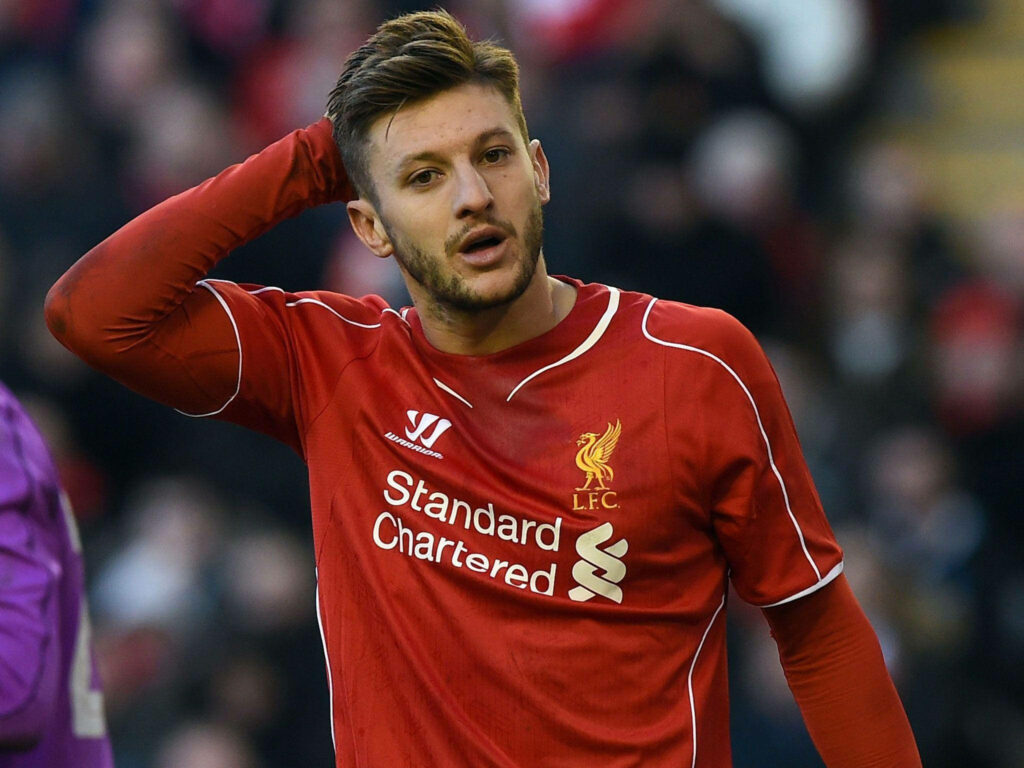 Adam Lallana in Liverpool FC kit resting hand on head during football match wallpaper background