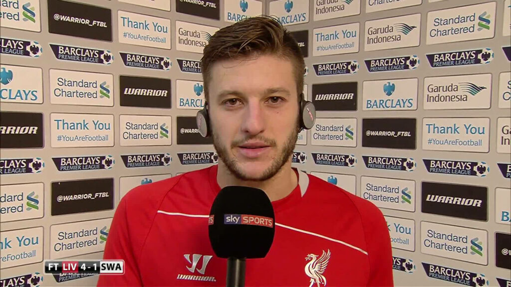Adam Lallana post-match interview Liverpool kit Sky Sports microphone sponsor backdrop wallpaper
