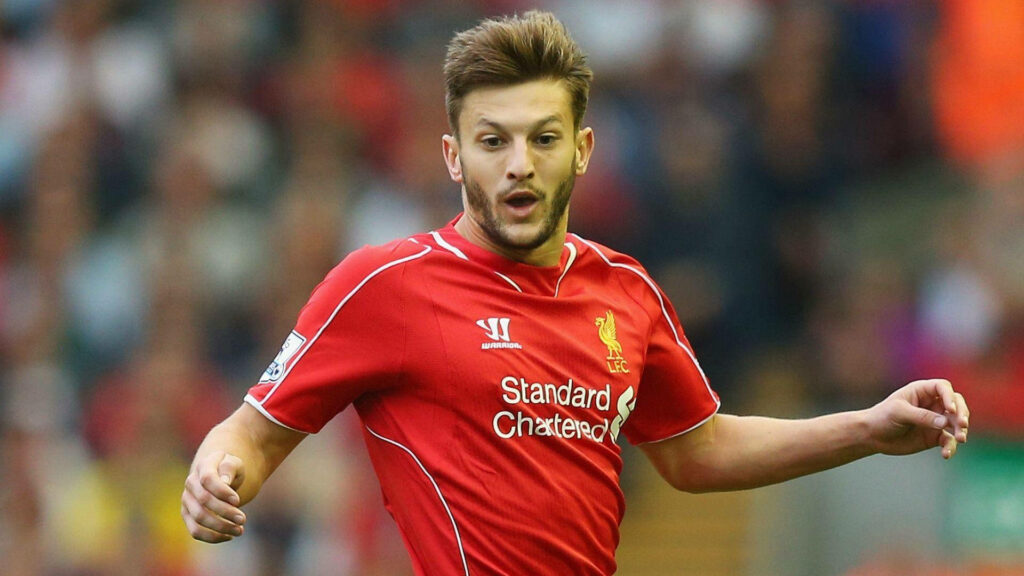 Adam Lallana in red Liverpool kit showing focus and energy during football match wallpaper background