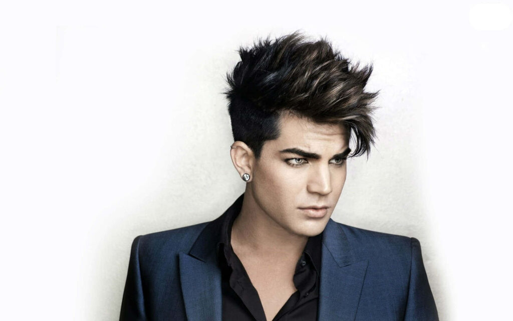 Adam Lambert stylish dark suit modern hairstyle elegant portrait on clean light background wallpaper