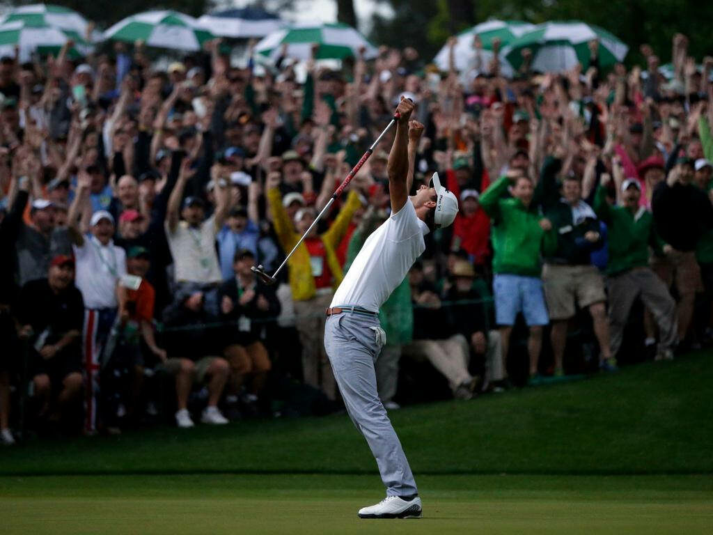 Adam Scott celebrating golf win with arms raised and cheering crowd on green background wallpaper