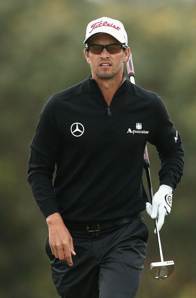 Adam Scott in black Mercedes jacket with Titleist cap holding golf club on golf course wallpaper