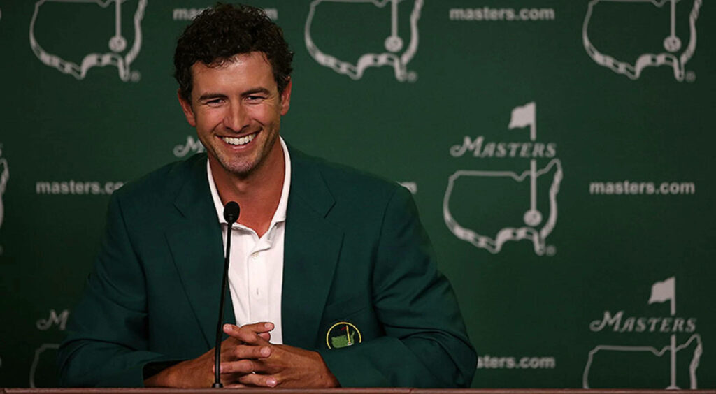 Adam Scott smiling in green Masters jacket at press conference celebrating golf victory wallpaper
