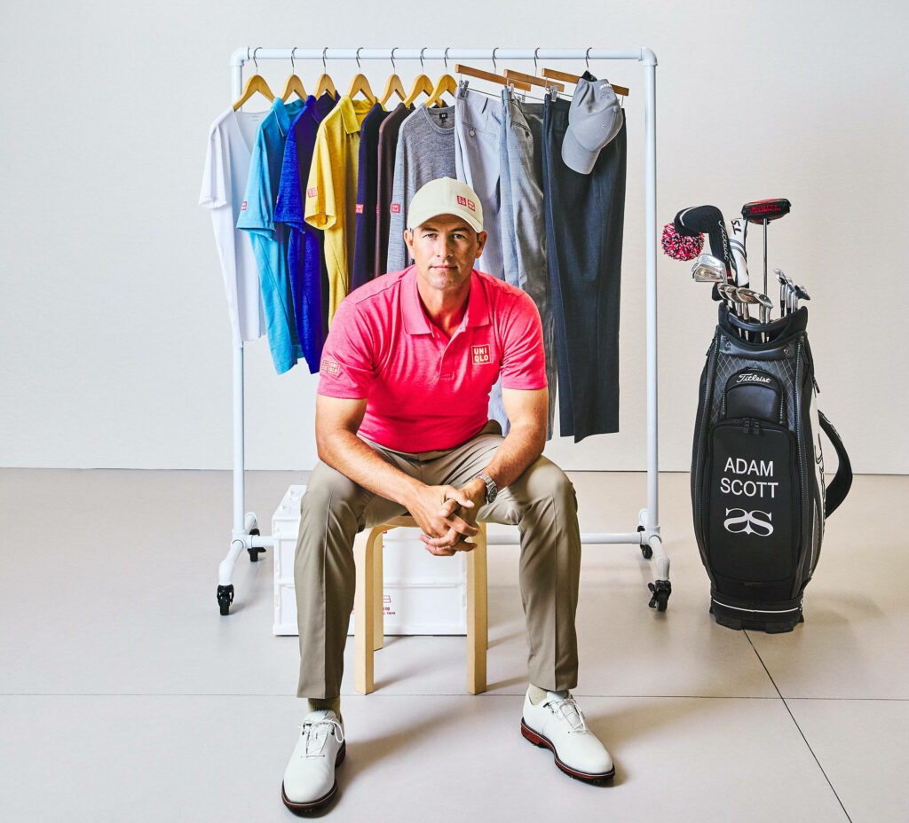 Adam Scott with Uniqlo golf apparel and accessories by clothing rack and personalized golf bag Wallpaper