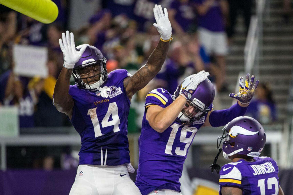 Adam Thielen's Victory Dance: Exciting Football Teamwork Wallpaper