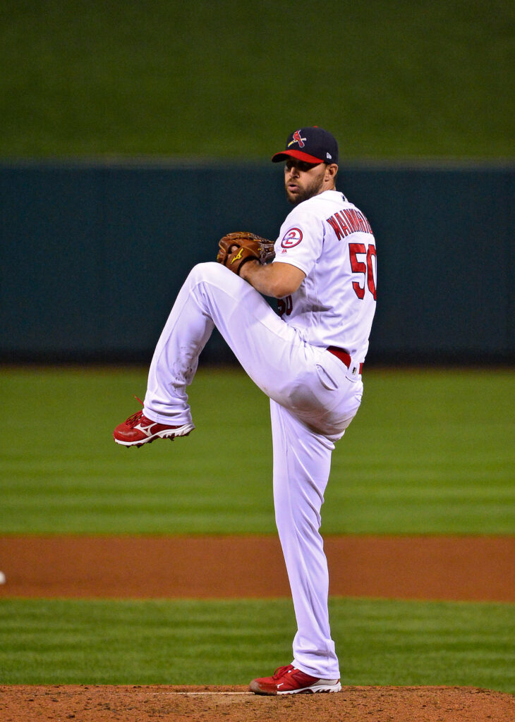 Adam Wainwright pitching on the mound for St Louis Cardinals in a professional baseball game wallpaper