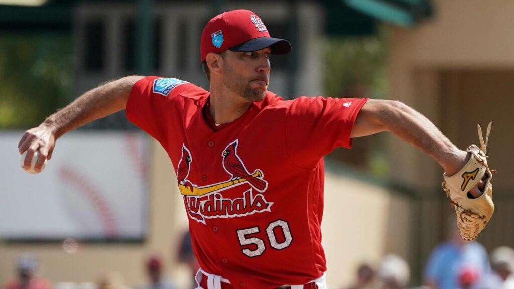Adam Wainwright mid-pitch in red St Louis Cardinals jersey showing focus and intensity Wallpaper