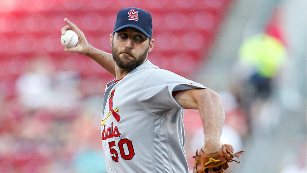 Adam Wainwright pitching in action on the mound during a dynamic baseball game wallpaper background