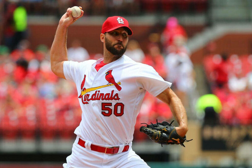 Adam Wainwright pitching in St Louis Cardinals uniform during game on baseball mound wallpaper background