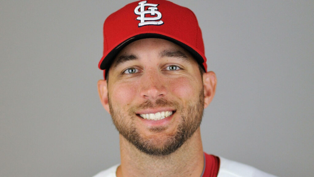 Close-up portrait of Adam Wainwright in St Louis Cardinals cap and jersey smiling wallpaper