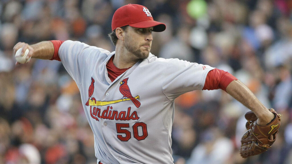 Adam Wainwright pitching in St Louis Cardinals uniform showing powerful throwing form Wallpaper