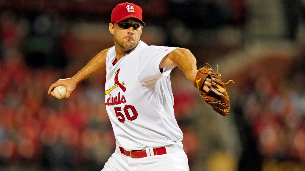 Adam Wainwright pitching in St Louis Cardinals uniform gripping mitt dynamic baseball wallpaper