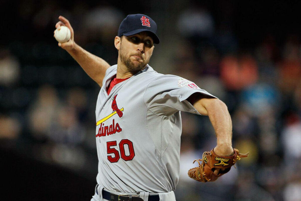 Adam Wainwright pitching in St Louis Cardinals uniform showing focused powerful throwing form Wallpaper
