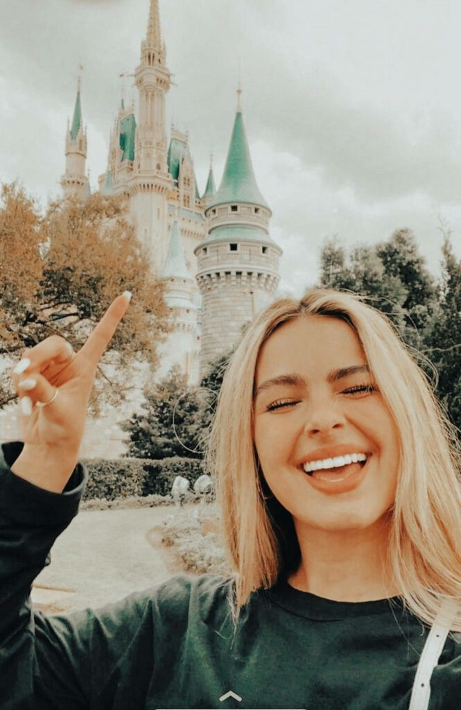 Addison Rae Joyful Wallpaper: Disneyland Castle Background