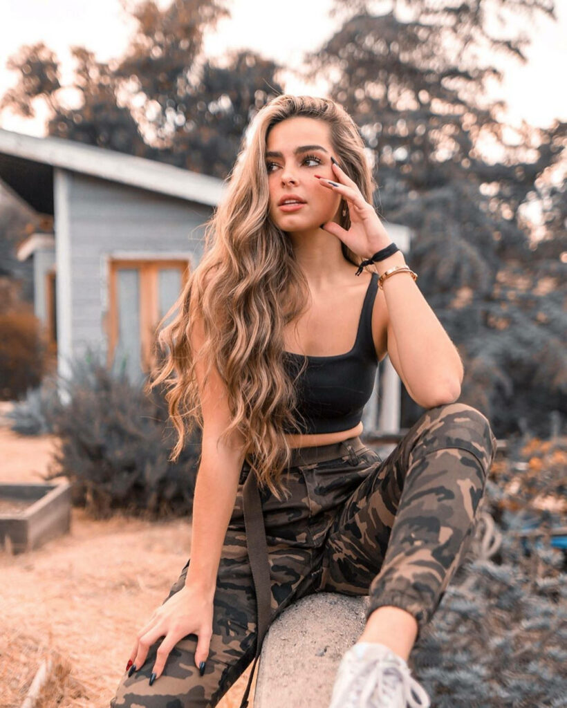Addison Rae Relaxing Outdoors: Sepia Wallpaper Background