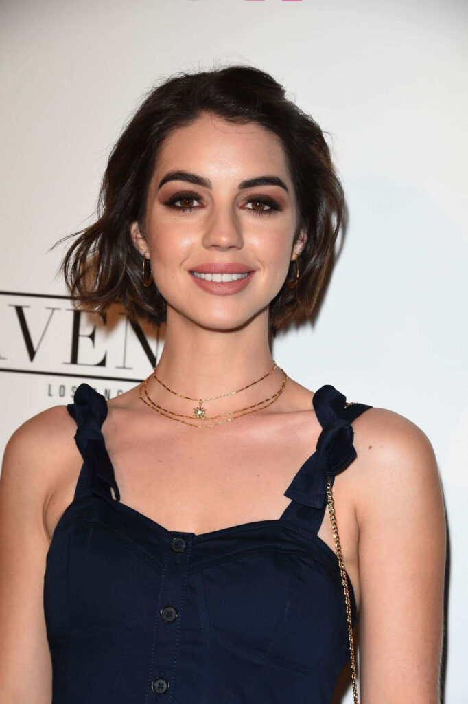 Adelaide Kane elegant event portrait with radiant smile and chic style on simple background Wallpaper