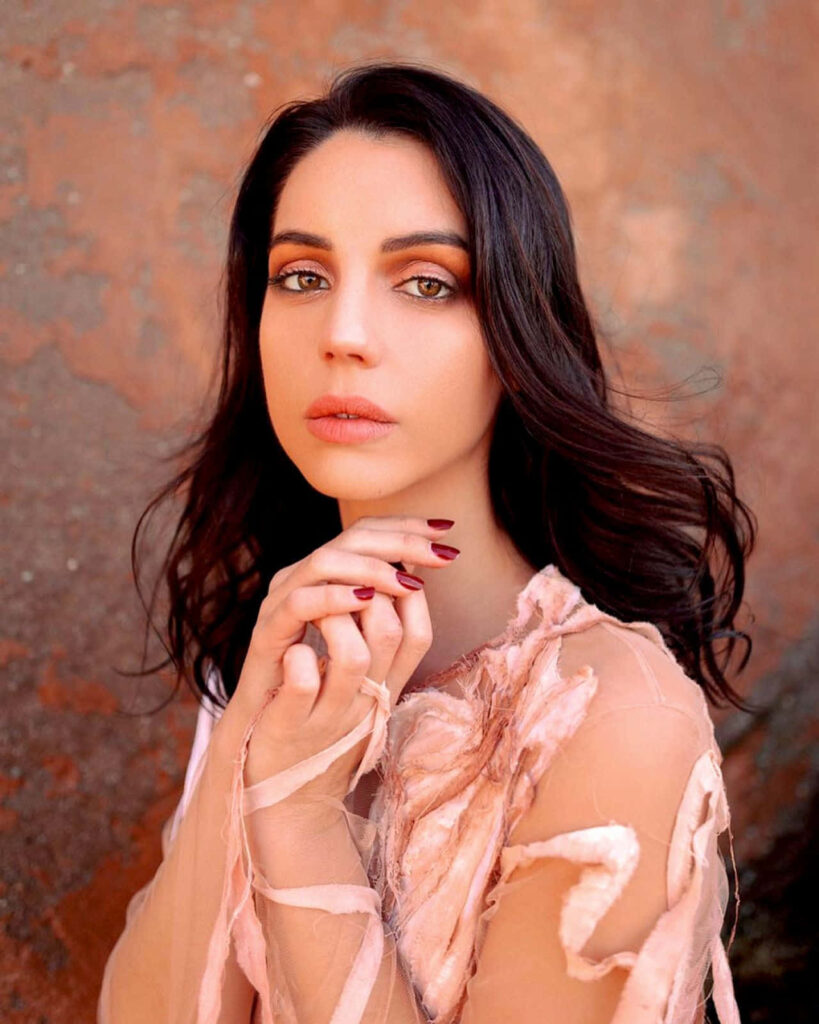 Adelaide Kane intense gaze elegant pose delicate attire striking sophisticated wallpaper background