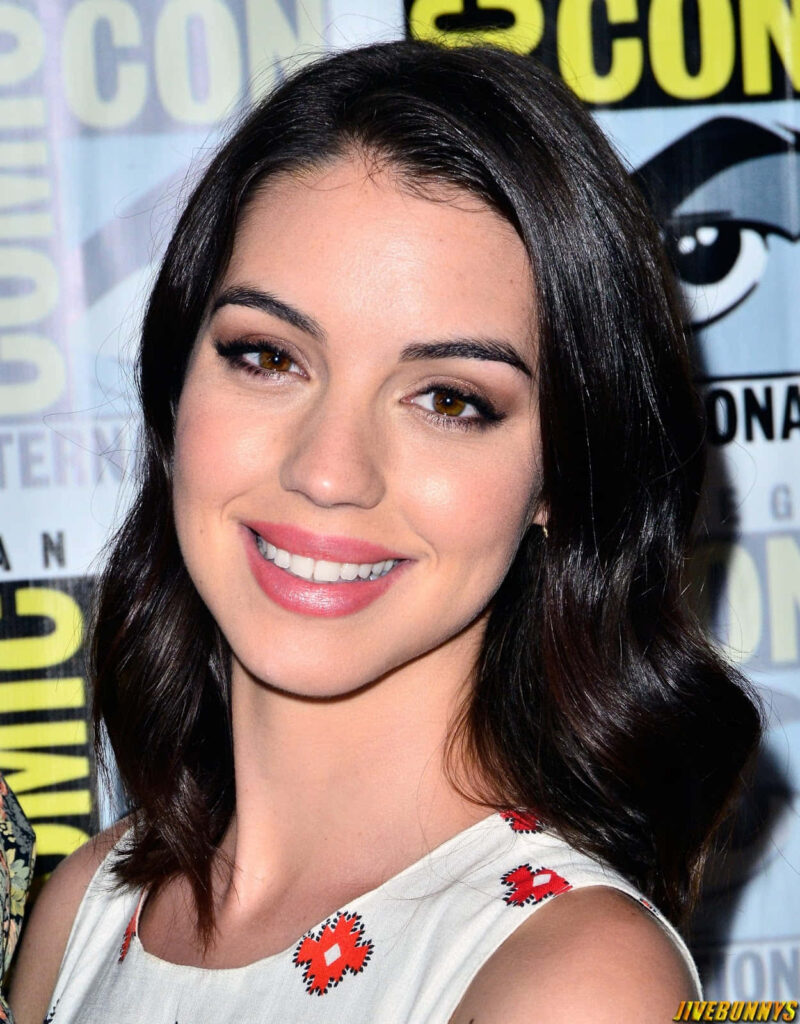 Adelaide Kane smiling brightly at Comic Con vibrant wallpaper background for fans