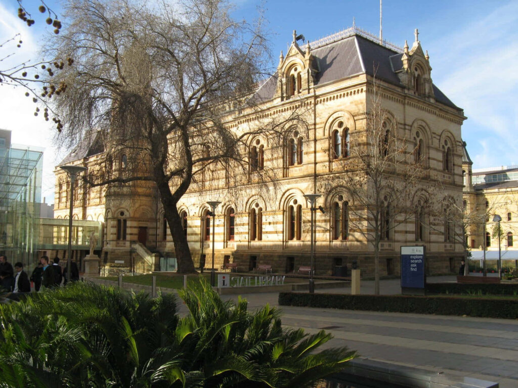 Adelaide State Library exterior with historic architecture and clear blue sky wallpaper background