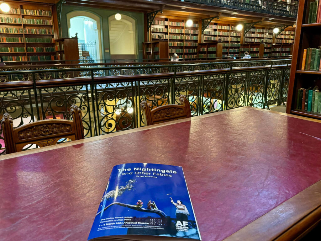 Adelaide State Library Reading Room with wooden desk program booklet grand shelves background Wallpaper