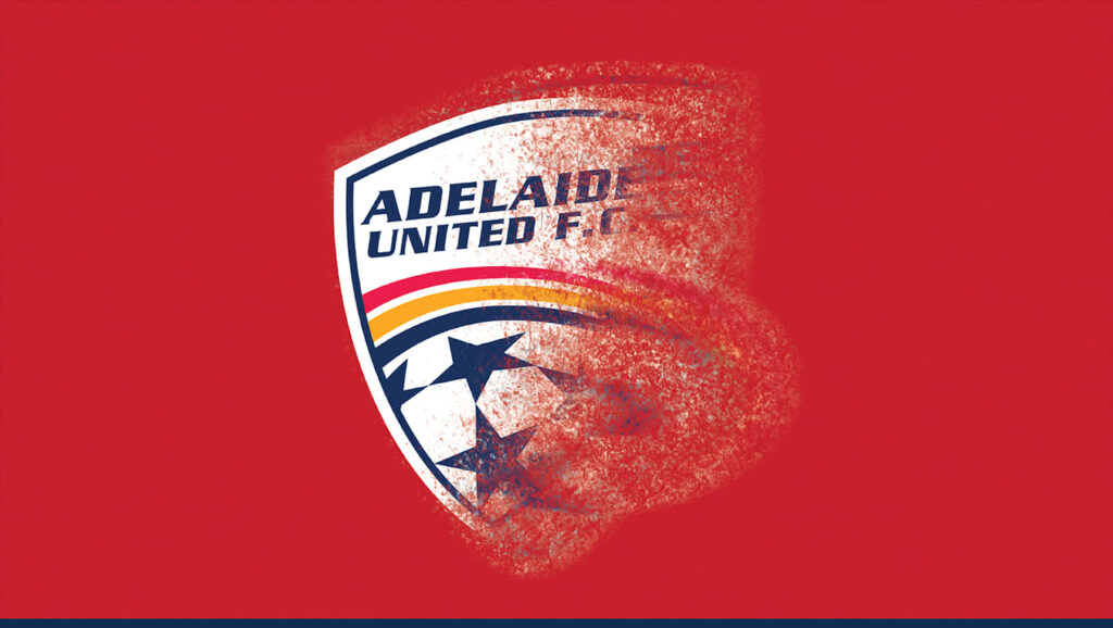 Adelaide United FC logo on vibrant red background celebrating football victory wallpaper