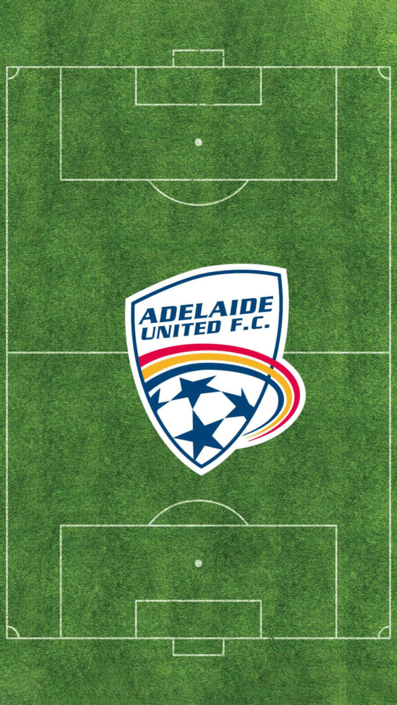 Adelaide United FC logo on green soccer field wallpaper showcasing team pride and spirit