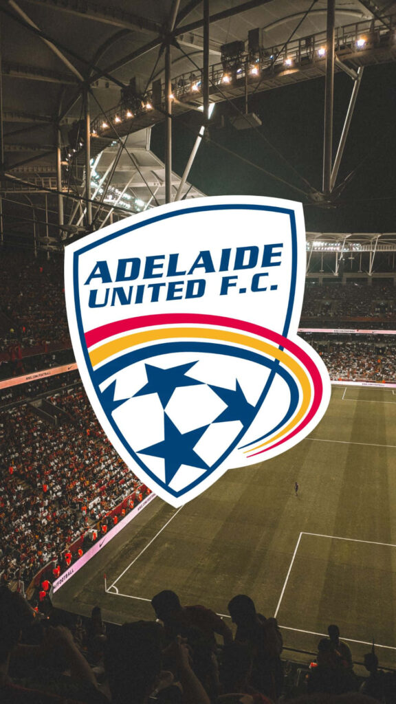 Adelaide United players celebrate football victory under bright stadium lights with cheering crowd Wallpaper