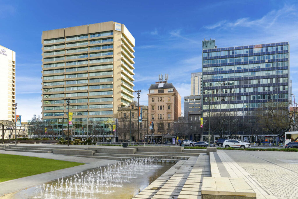 Adelaide Victoria Square urban landscape with high-rises fountain and vibrant public spaces wallpaper
