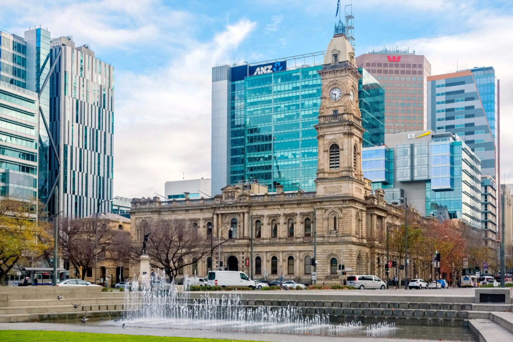 Historic Adelaide Victoria Square clock tower modern buildings lively fountain wallpaper background