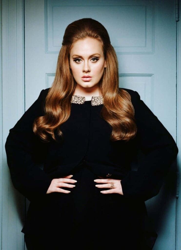Adele Posing Elegantly in Black - Stylish Wallpaper Background