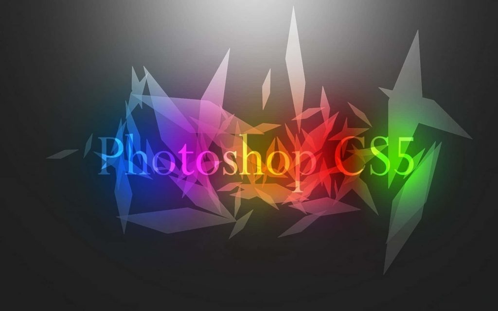 Abstract Adobe Photoshop CS5 logo with colorful geometric crystal shards on dark background wallpaper