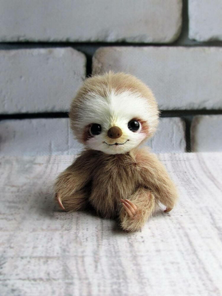 Charming Baby Sloth Wallpaper: Cute Plush Decor for Any Space