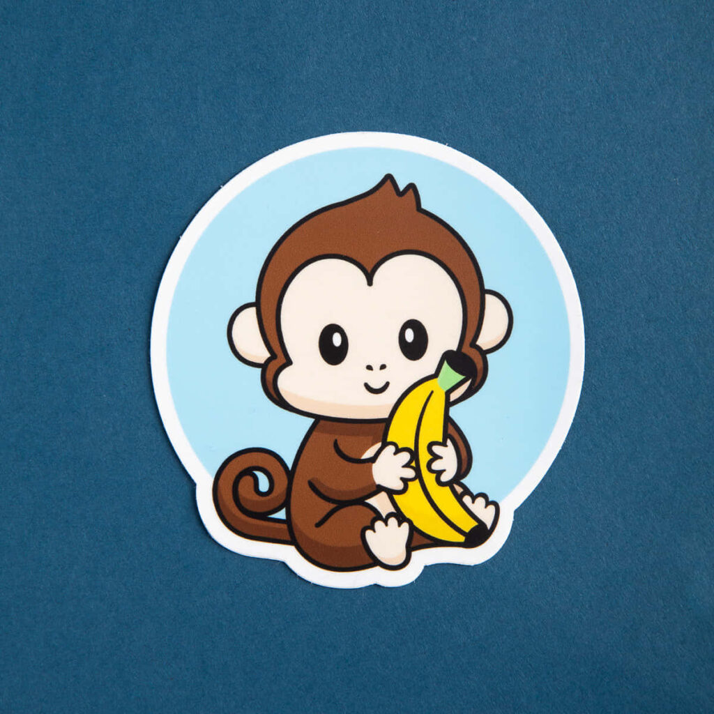 Charming Cartoon Monkey Wallpaper with Banana on Blue Background