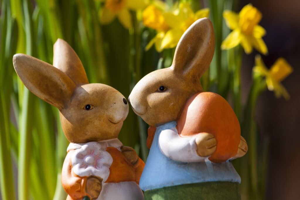 Adorable Easter Bunnies Wallpaper with Bright Yellow Flowers
