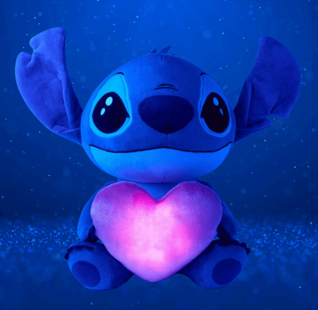 Glowing Plush Character with Pink Heart in Starry Galaxy Background Wallpaper