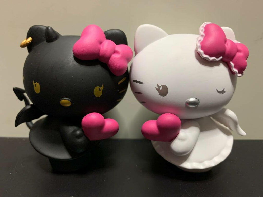 Charming Halloween Hello Kitty Wallpaper: Black & White Figures