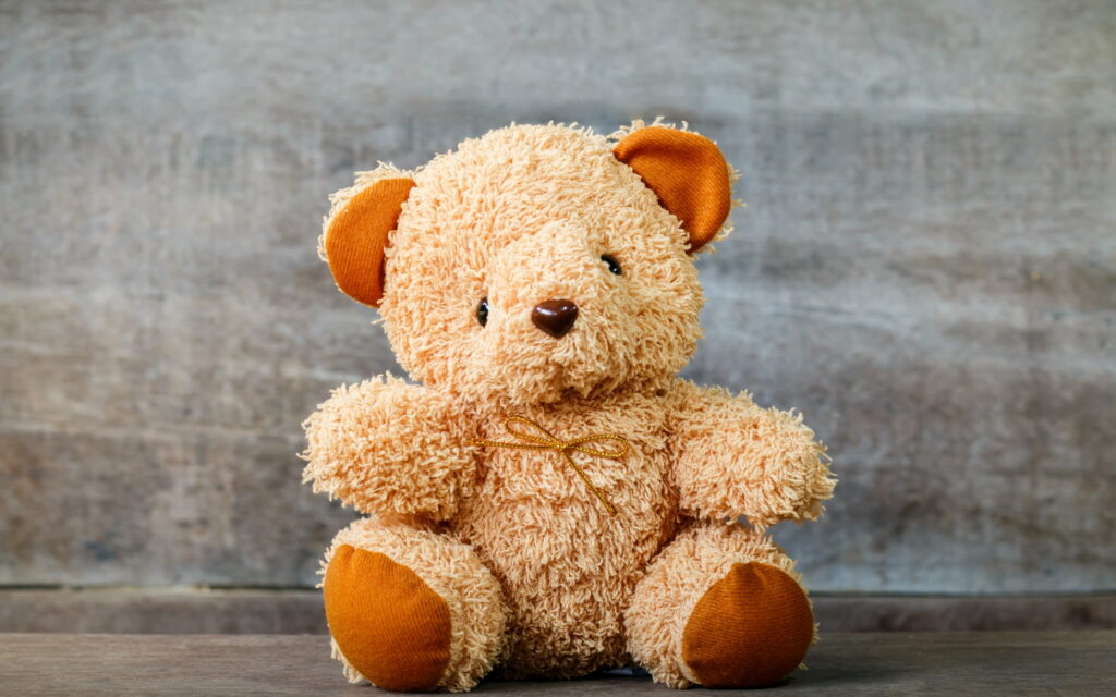 Adorable Little Brown Bear Cub - A Perfect Gift for Toy Lovers! Wallpaper