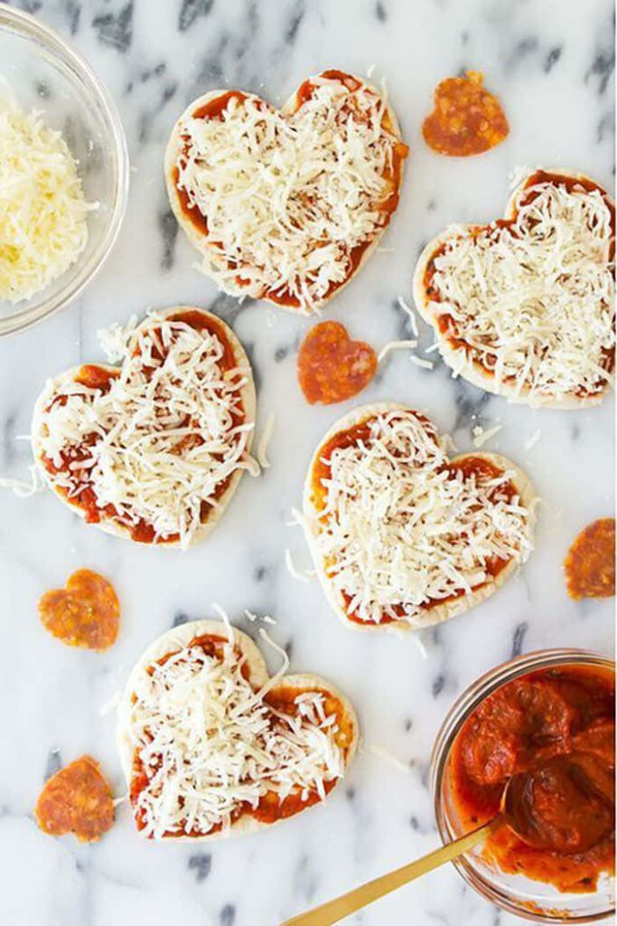 Adorable Mini Heart-Shaped Pizza Wallpaper for Romantic Occasions