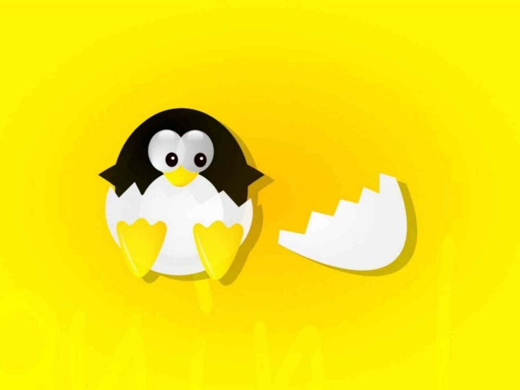 Cheerful Penguin with Egg Wallpaper on Bright Yellow Background