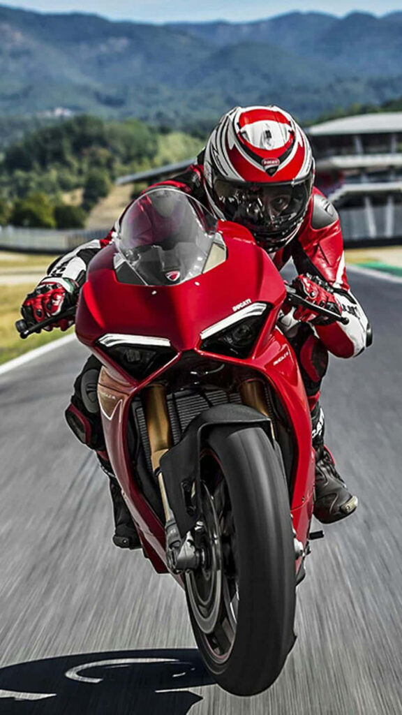 Superbike Adventure: Thrilling Ride Through Scenic Green Hills Wallpaper