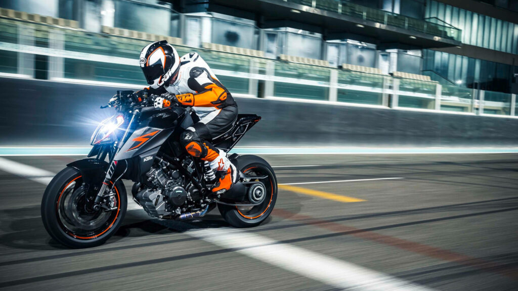 4K Speed Rider KTM Motorcycle Wallpaper - Thrilling Urban Adventure