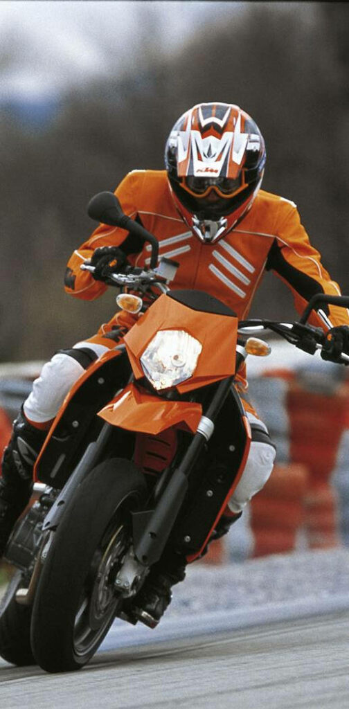 Adrenaline-Packed iPhone Wallpaper: Motocyclist on KTM Racing Bike