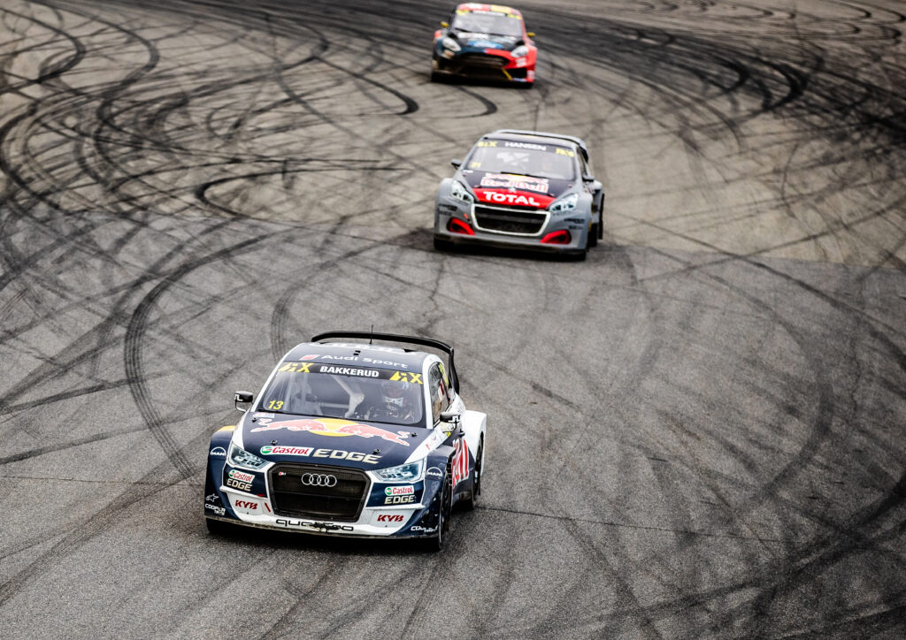Adrenaline-Filled Race Day: Audi and Race Cars in Action Wallpaper